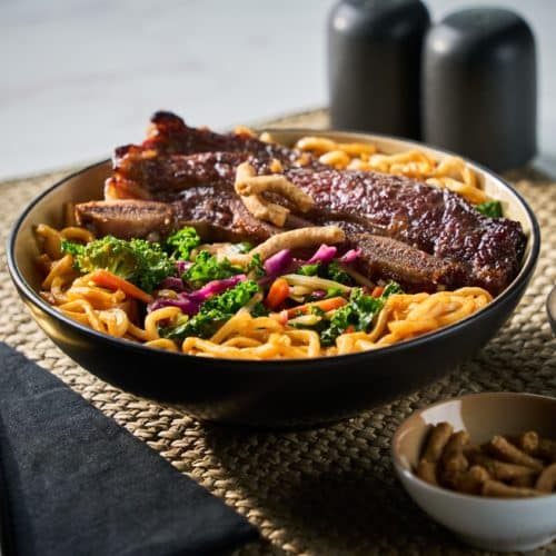 Make these grilled Korean beef short ribs the next time you are craving something bursting with sweet and savory flavor! Ribs cut Flanken style take less than 10 minutes to grill. Serve on top of the Korean Sesame Hot or Cold Salad and Noodle Meal Kit for a restaurant quality meal. Delicious!